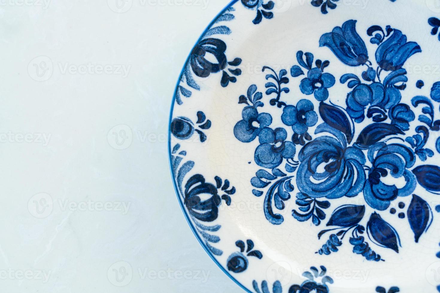 beautiful vintage porcelain plate on table photo