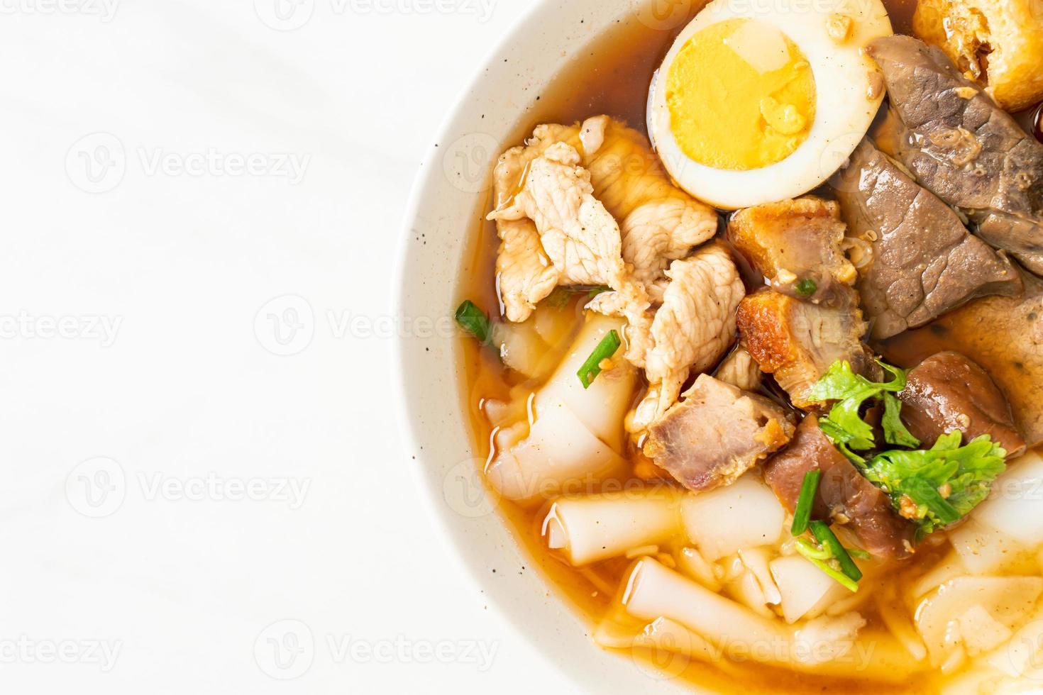 paste of rice flour or boiled Chinese pasta square in clear soup photo
