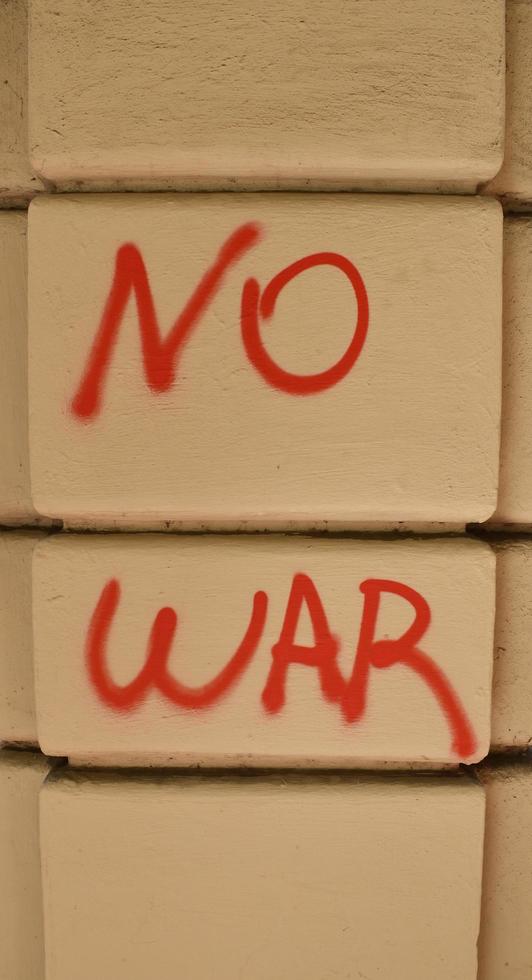 No war, isolated red text written on the wall. photo