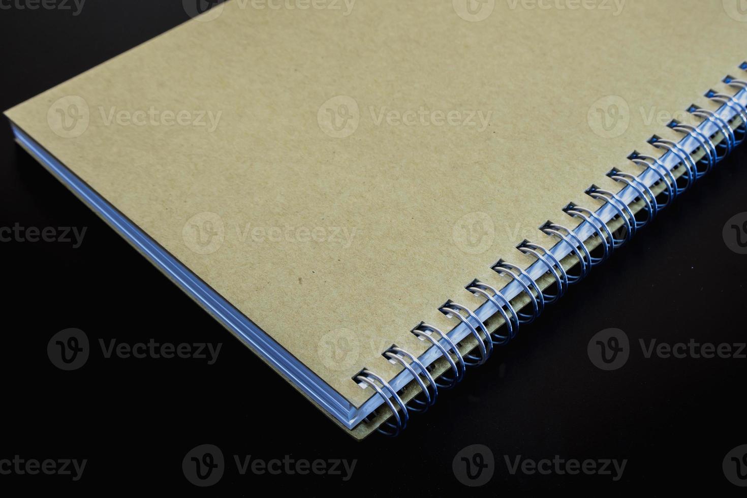 Blank cover of Note Book on Black background photo