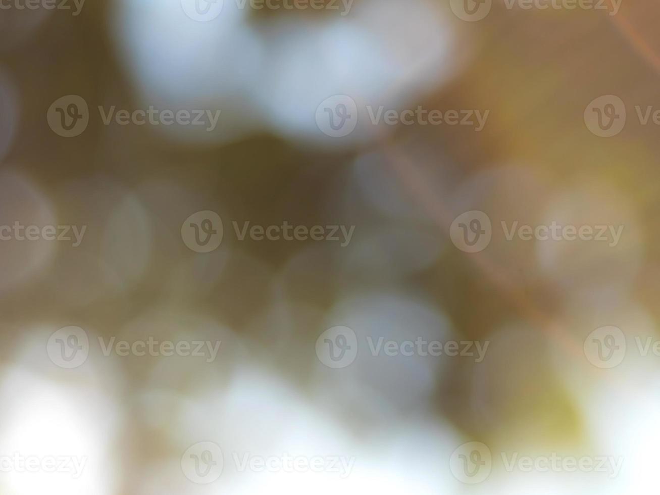 Natural outdoors bokeh background in green and yellow tones, Blurred green tree leaf background with bokeh photo