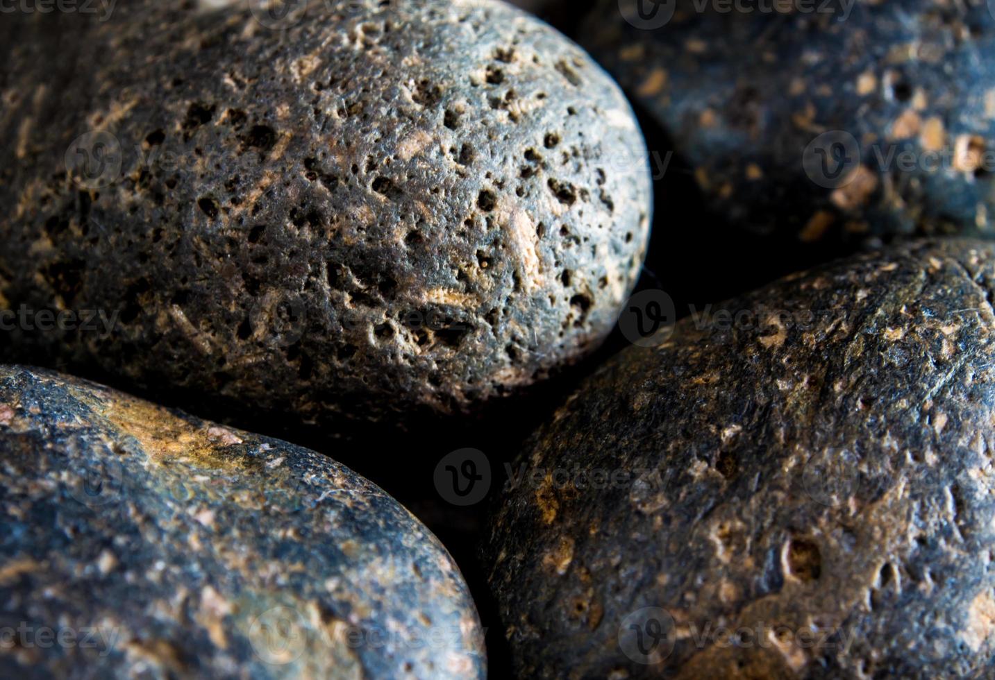 Textura de fondo de piedra de río gris redondo seco foto