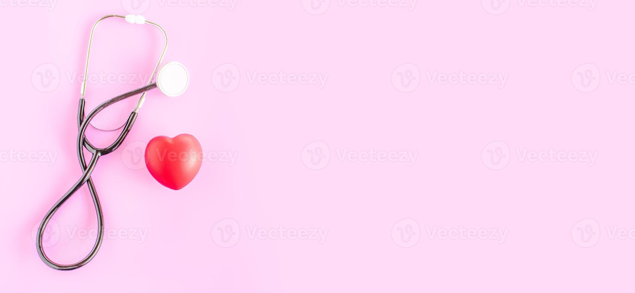 Happy nurse's day. Health day. Stethoscope, red heart, on pink background. Greeting background. National doctor's day. Top view, Copy space on right. Thank you, doctors and nurses. Selective focus photo