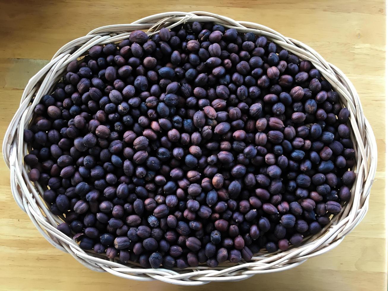 Organic asian coffee bean on wicker basket. photo