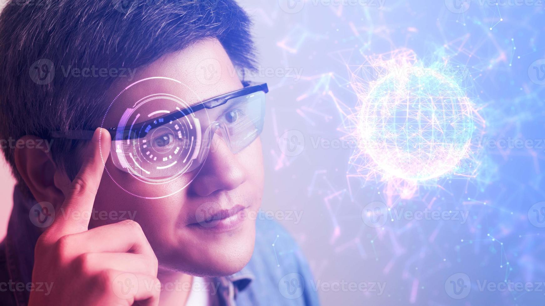 The metaverse universe, Man wearing augmented reality on virtual screen future technology, The real world with the virtual world overlapped, transformed into the virtual world. photo