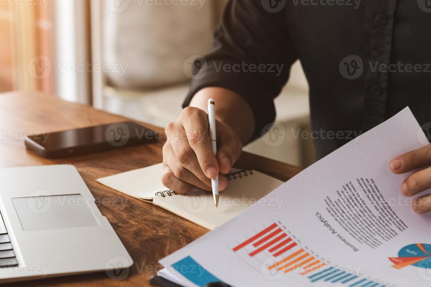 male executive analyzing and planning business sales performance from financial data, analyzing finance sales data and economic growth graph chart. photo