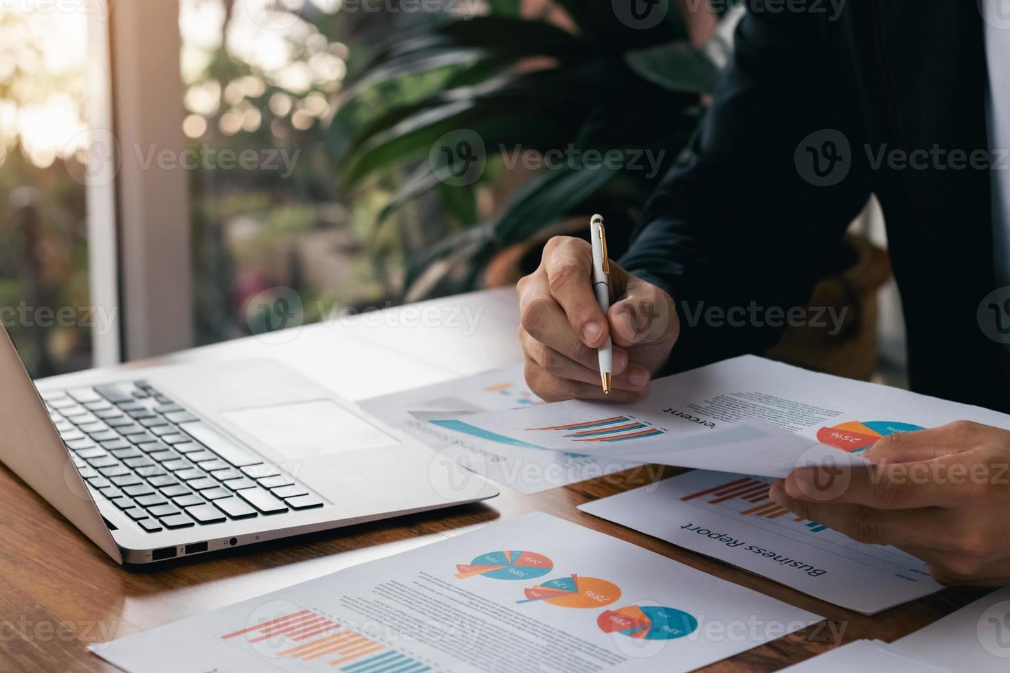 male executive analyzing and planning business sales performance from financial data, analyzing finance sales data and economic growth graph chart. photo