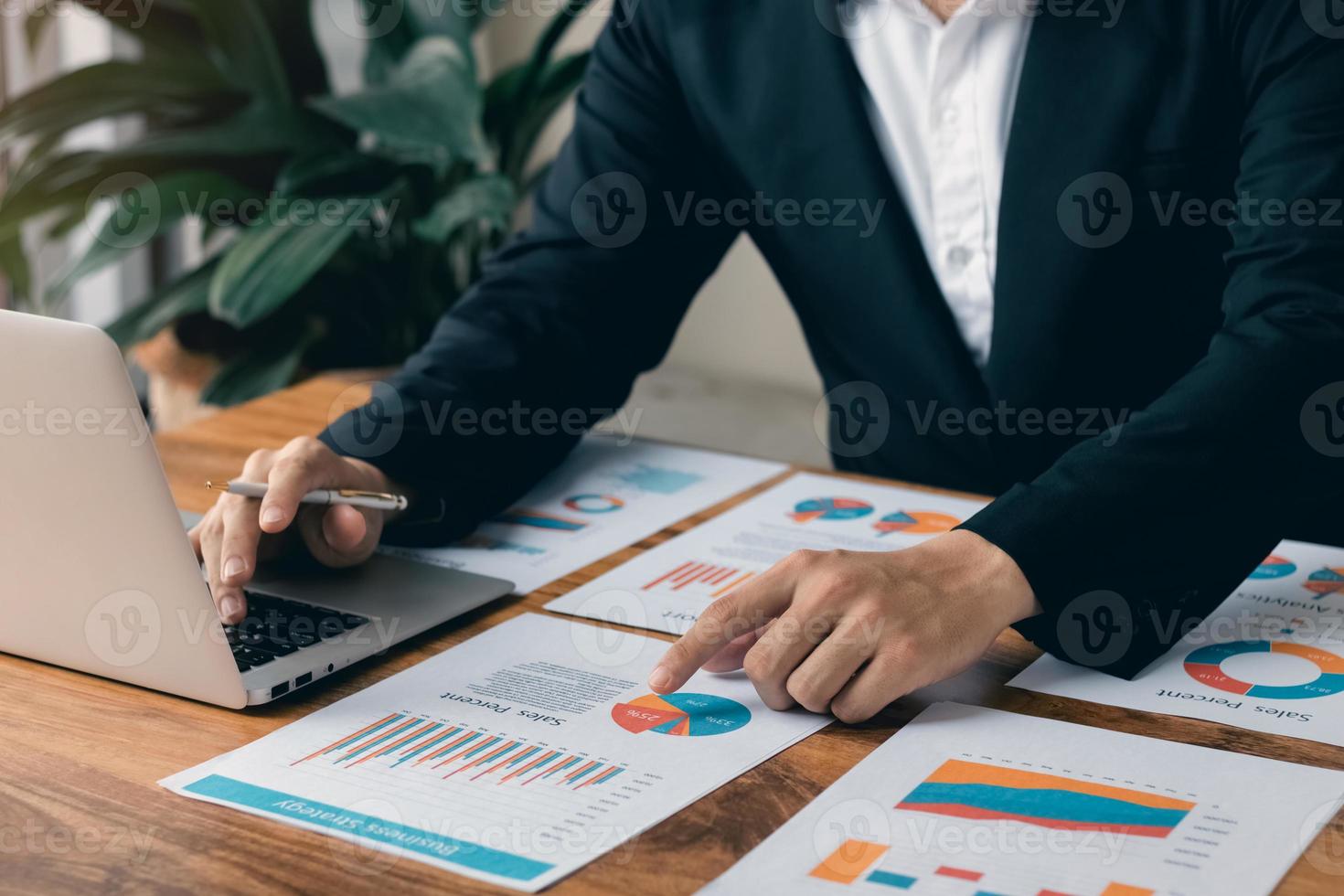 male executive analyzing and planning business sales performance from financial data, analyzing finance sales data and economic growth graph chart. photo