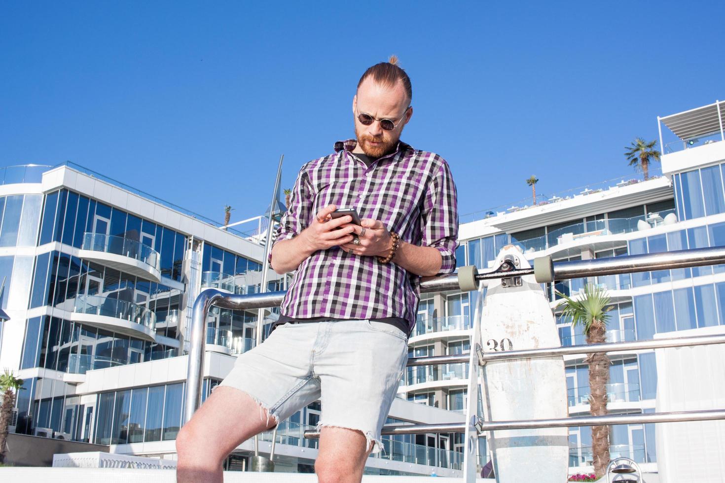 Young bearded man make selfie on phone photo