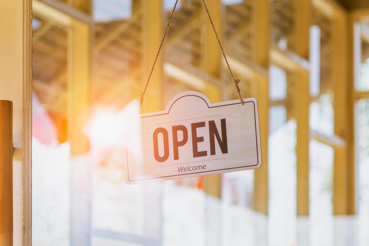 Open sign hanging on door cafe photo