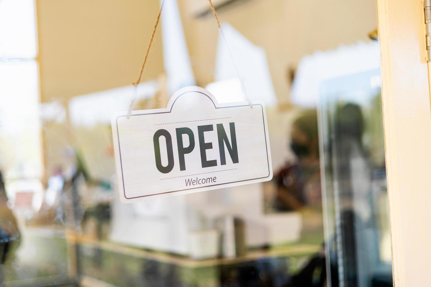 Open sign hanging on door cafe photo