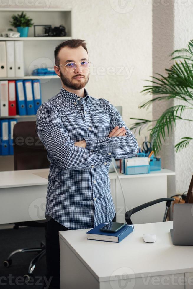 Businessman working on his laptop in an office photo