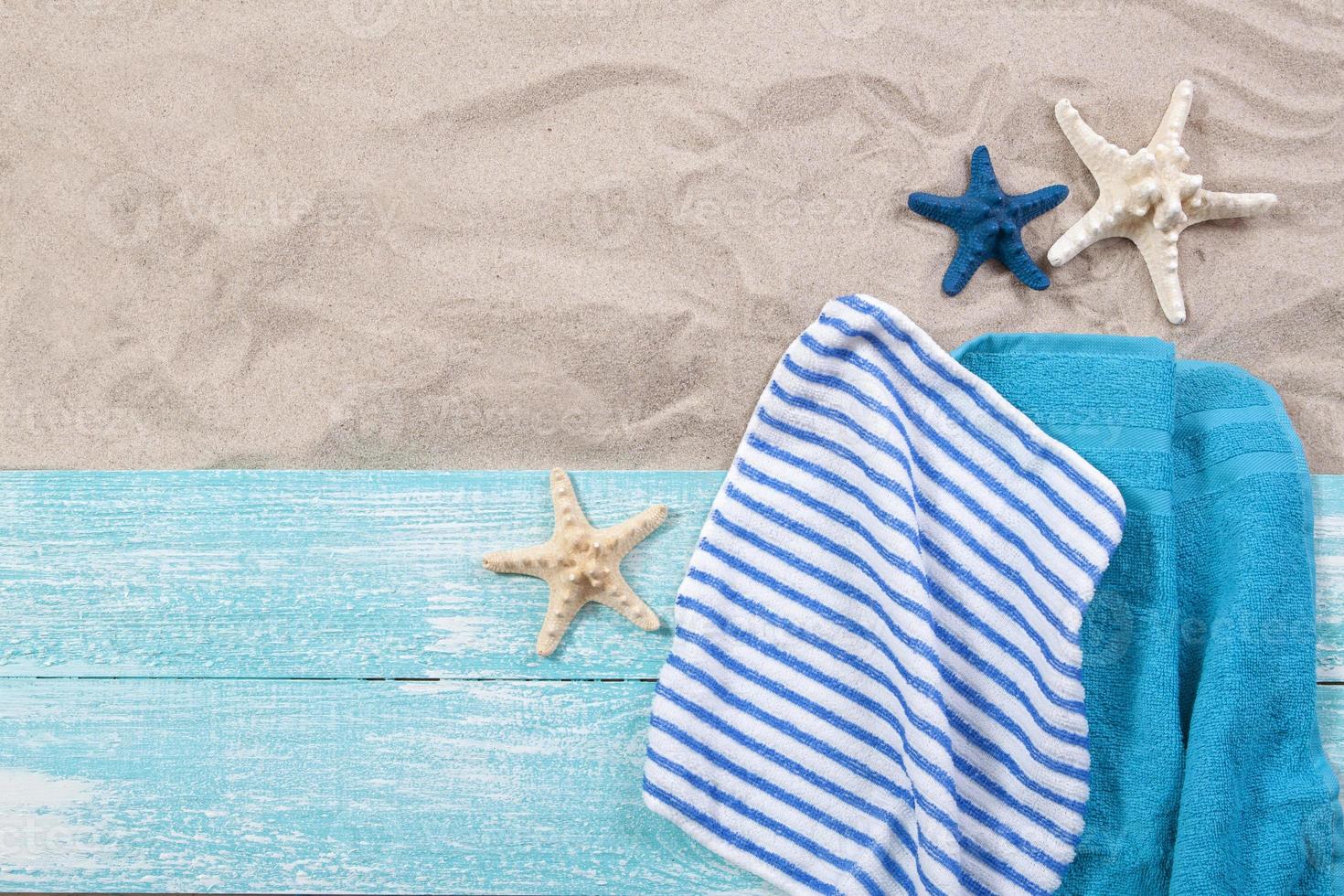 Sand copy space. Sand background top view. Beach towels and starfish photo