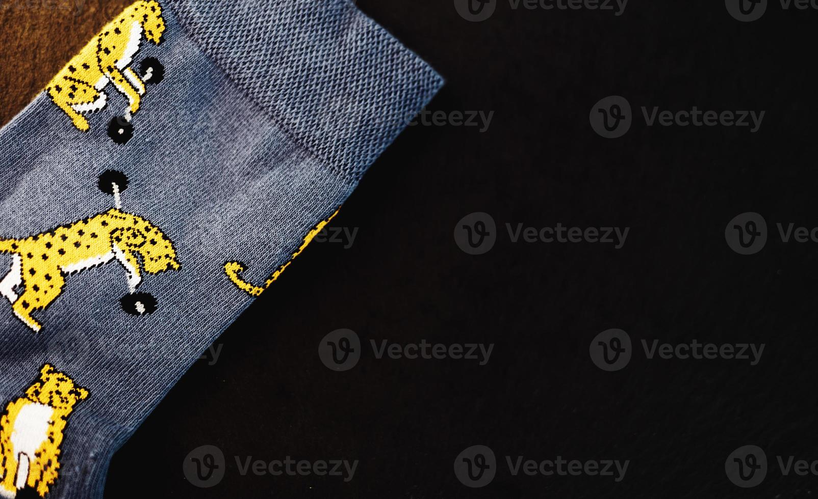 funny socks on dark background. photo
