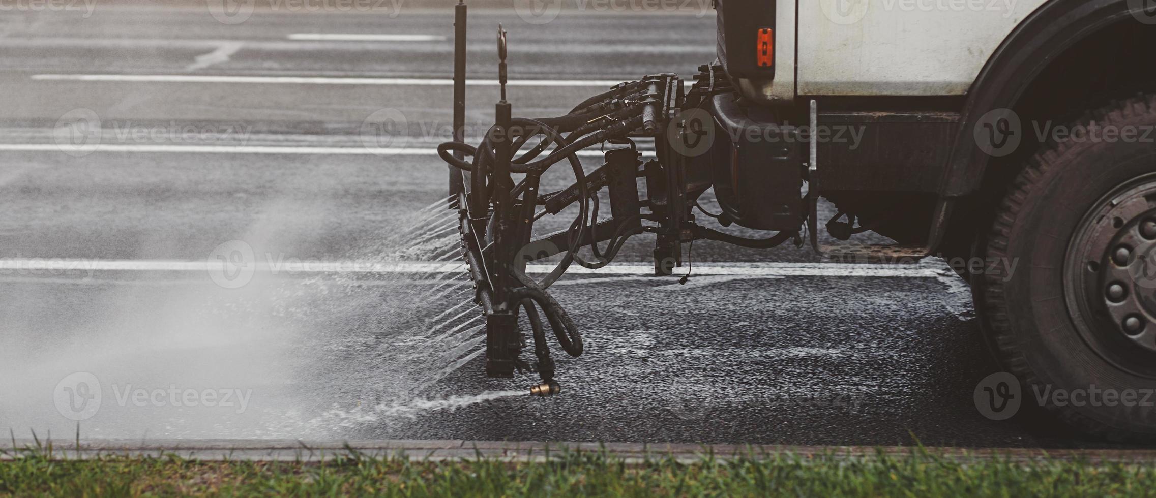 machines washes the city asphalt road photo