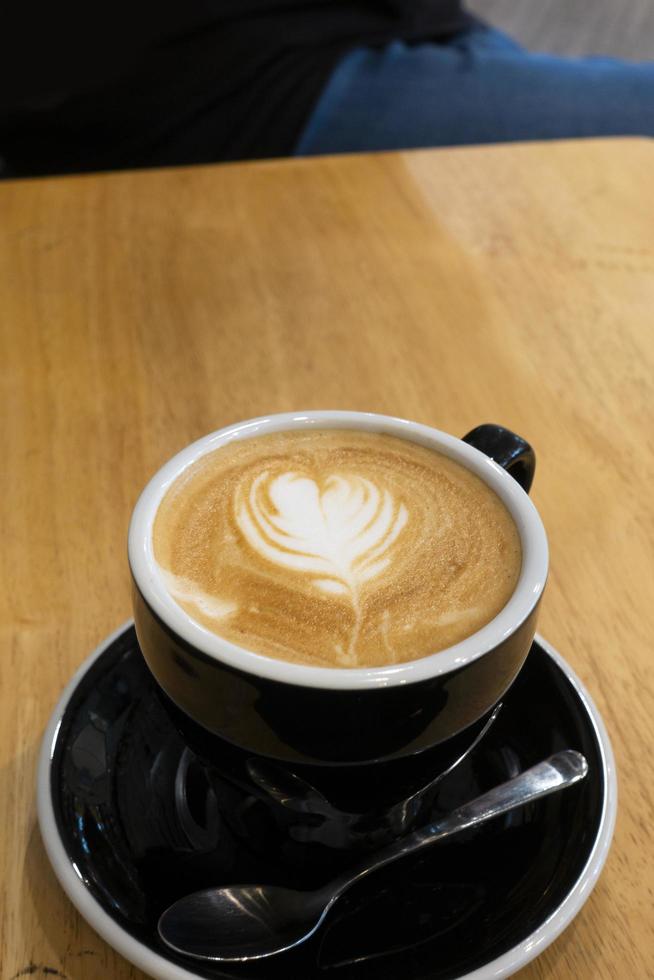 Hot coffee on a wooden table photo