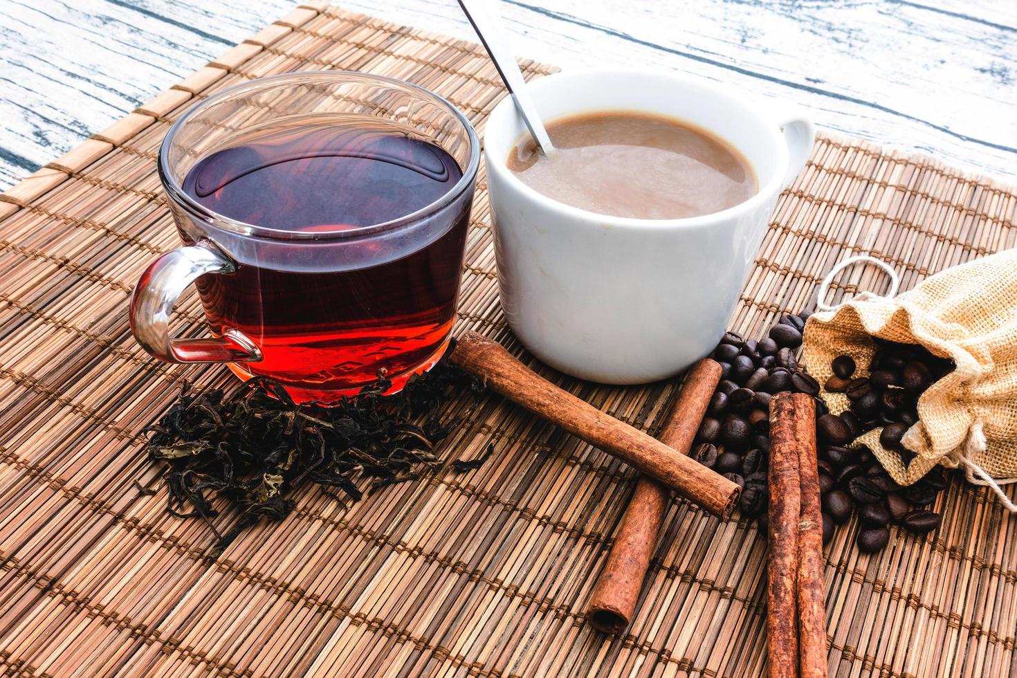 hot coffee with hot tea and coffee beans,tea leaves photo