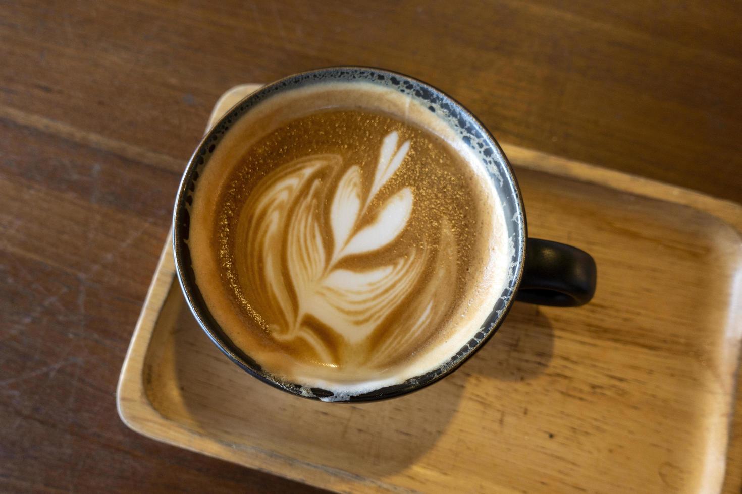 Hot coffee on a wooden table photo