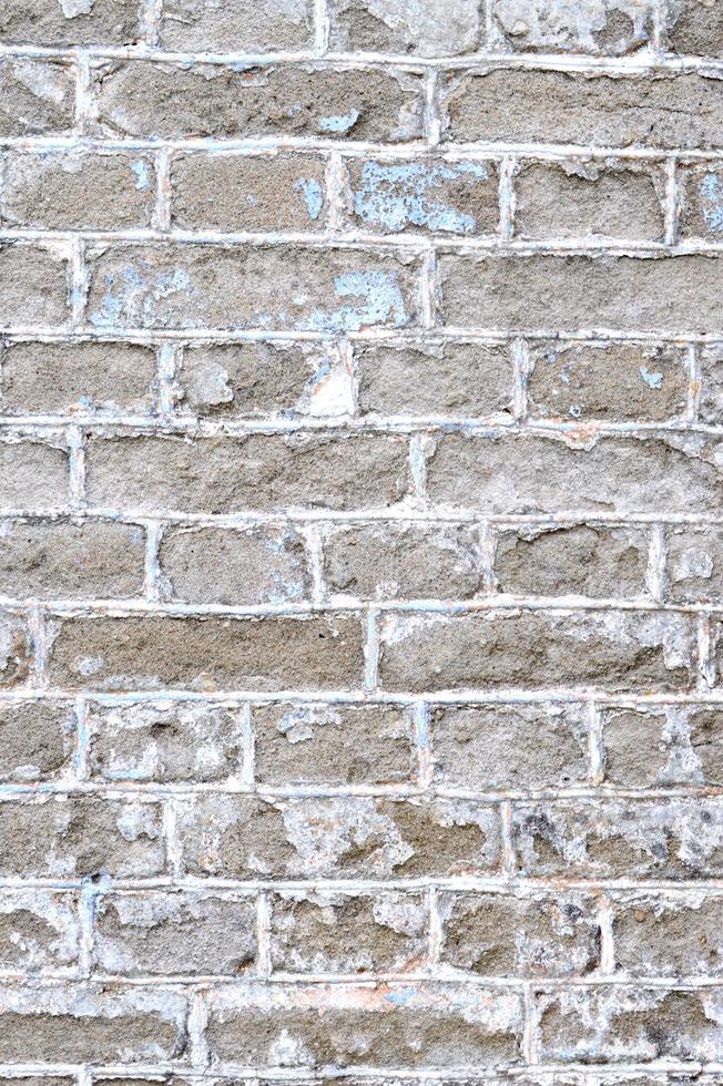 Old brick wall. Ancient stone texture background. Urban background, white ruined industrial brick wall with copy space. Home and office design backdrop. Vintage effect. Vertical photo. photo