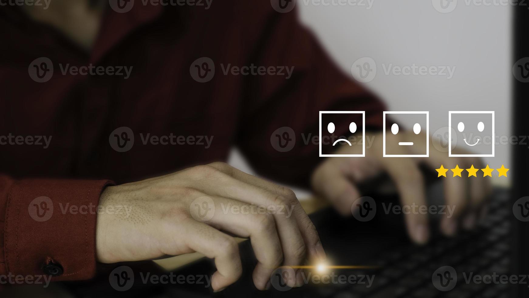 Customer service satisfaction survey concept.Business people or customers show satisfaction through the application on the phone screen. By giving the most satisfaction rating and 5 stars. photo