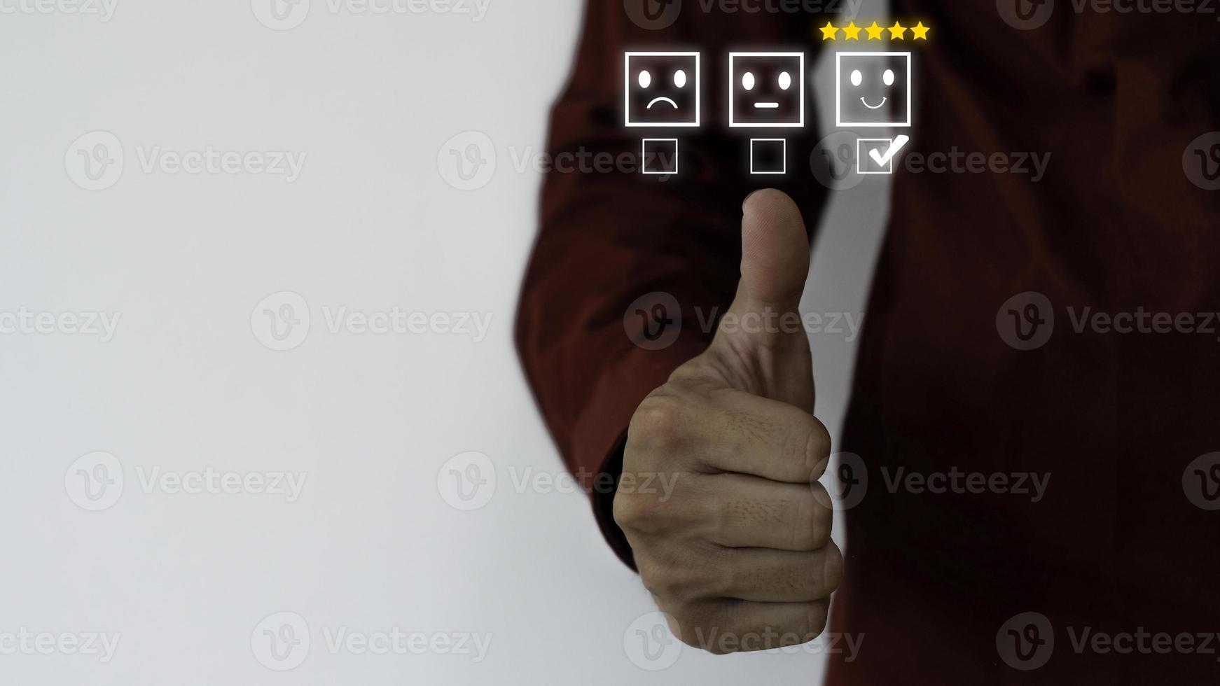 Close up on Customer Man Hand pressed on smartphone screen with top level feedback icon for best rating on business idea service review. photo