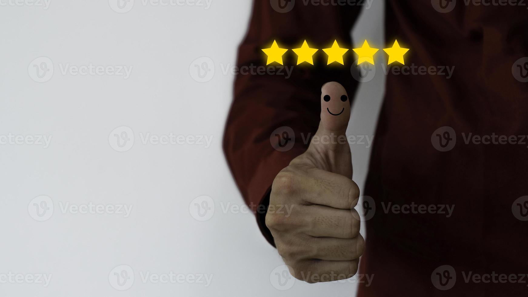 Close up on Customer Man Hand press on smartphone screen with gold five star comment icon and excellent press level for best rating in business idea service review. photo