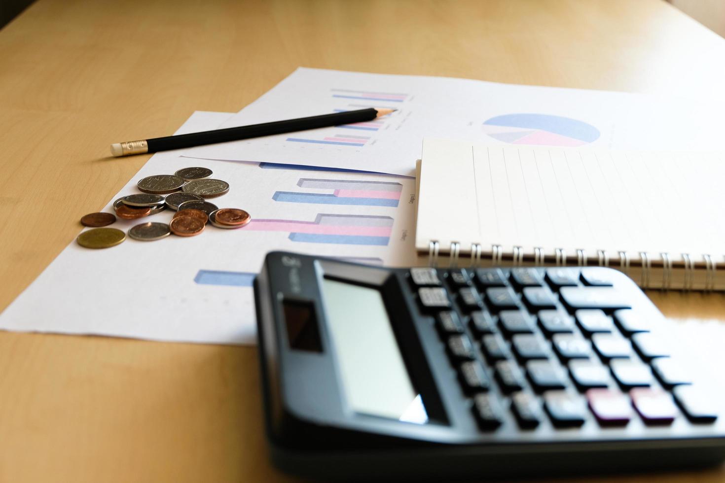 Blurred selective focus, Cost reduction calculating on financial, tax and business infographic graph pie chart. Tax and expense cost saving for personal. Economic crisis during Covid-19 pandemic photo