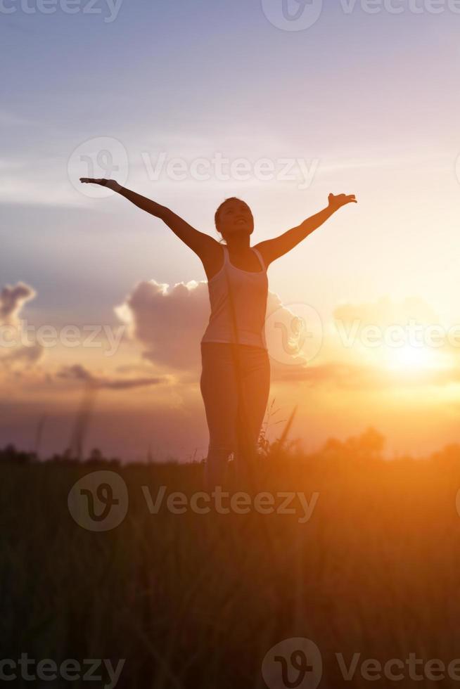 Young woman raise hands up for her success, Concept of Success in life. photo