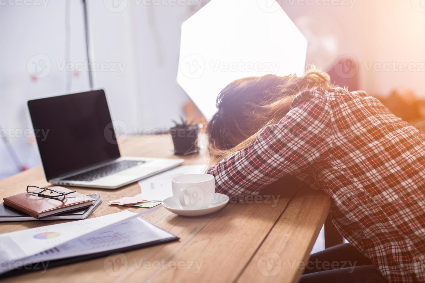 Young business woman tired and headache about her work. photo