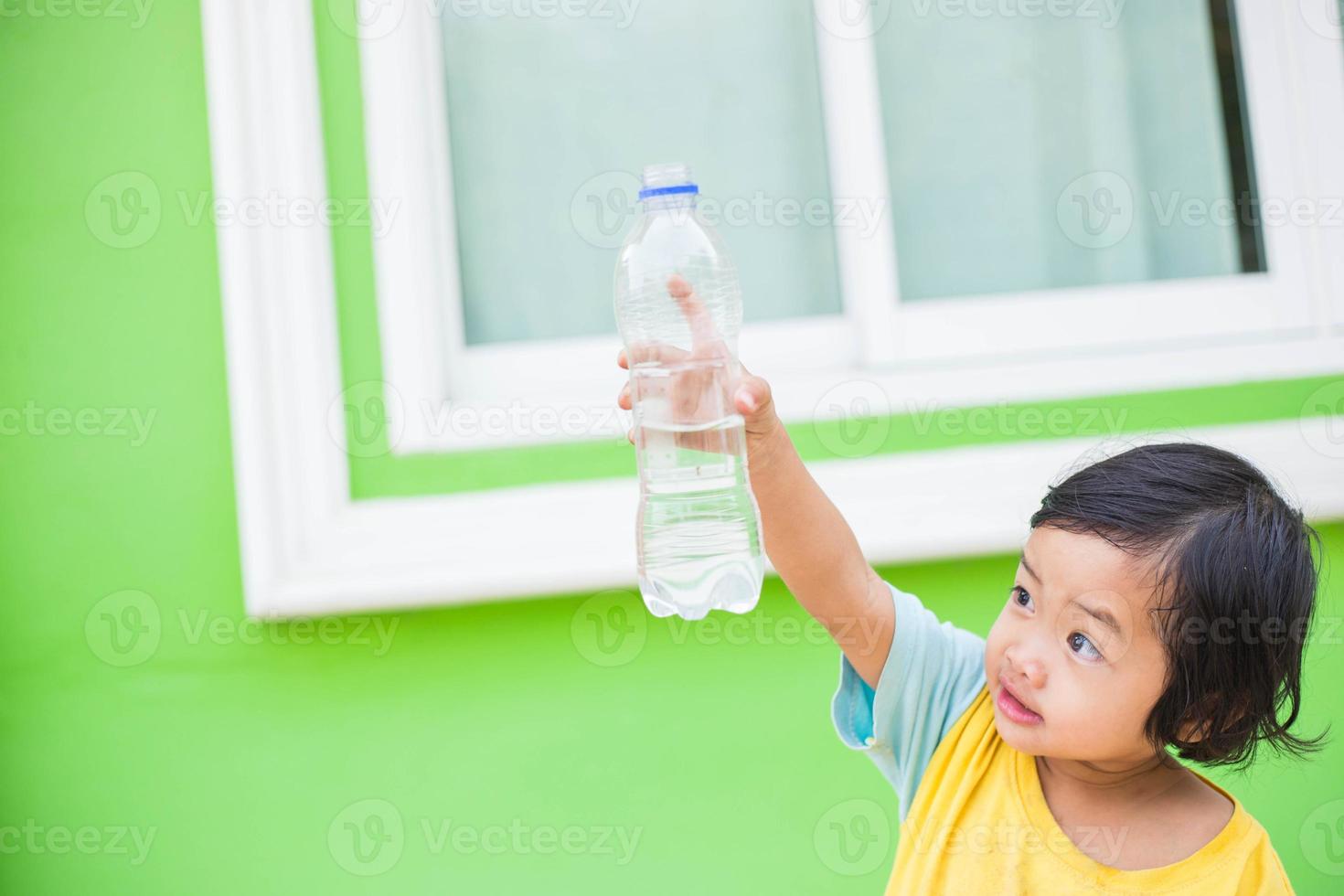 Thirsty Girl Drinking Water Outdoors photo