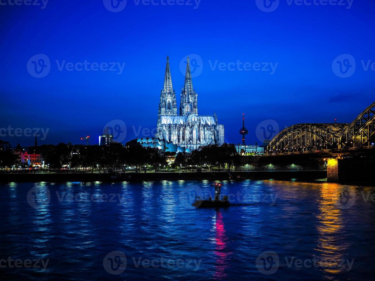 HDR St Peter Cathedral and Hohenzollern Bridge over river Rhine photo