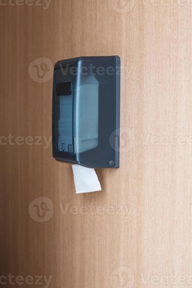 Tissue box on the wall in the bathroom photo