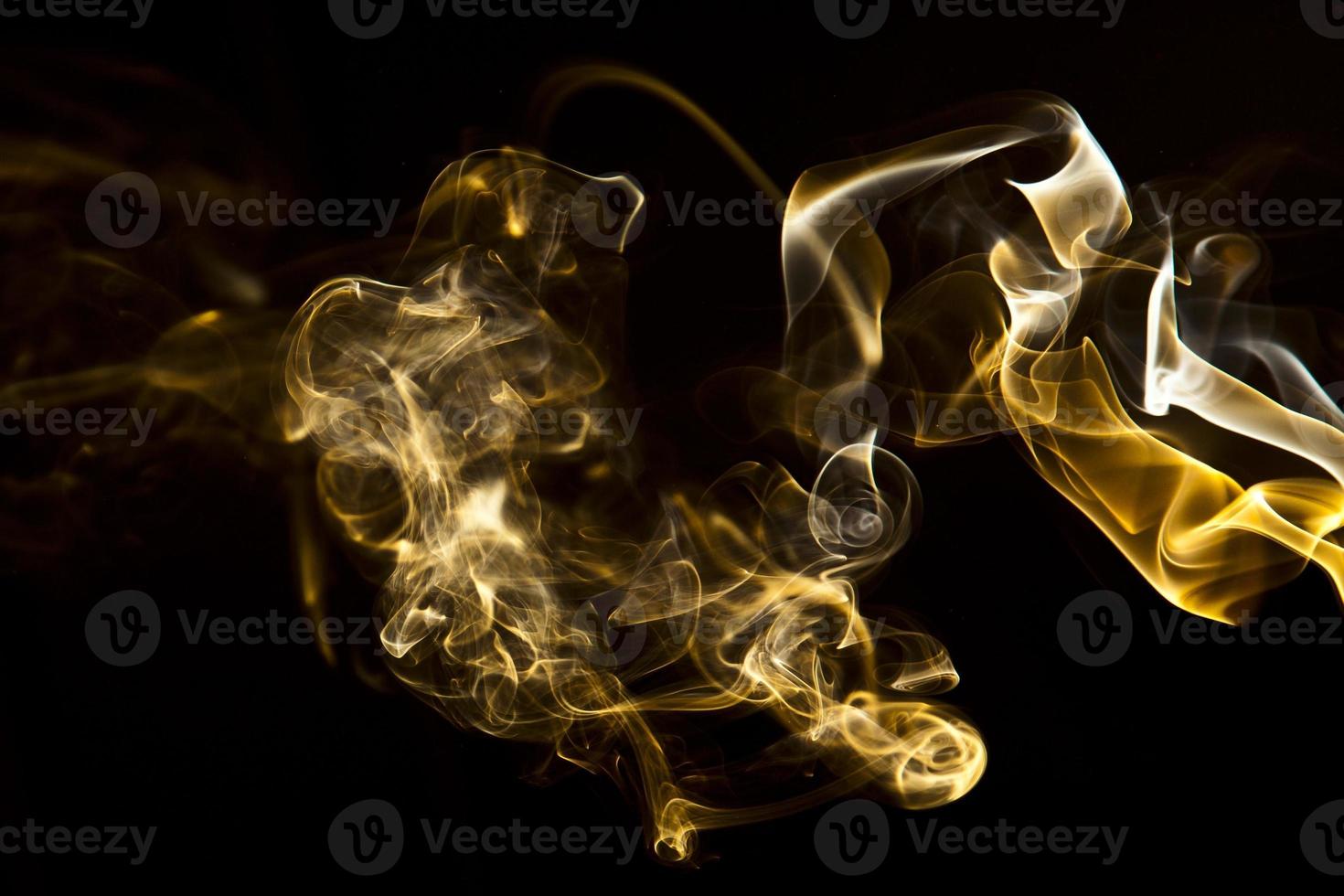 Colorful smoke on black background photo