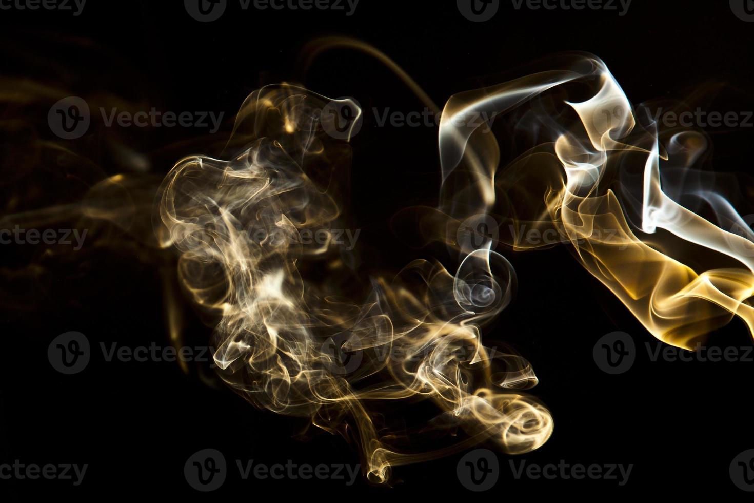 Colorful smoke on black background photo