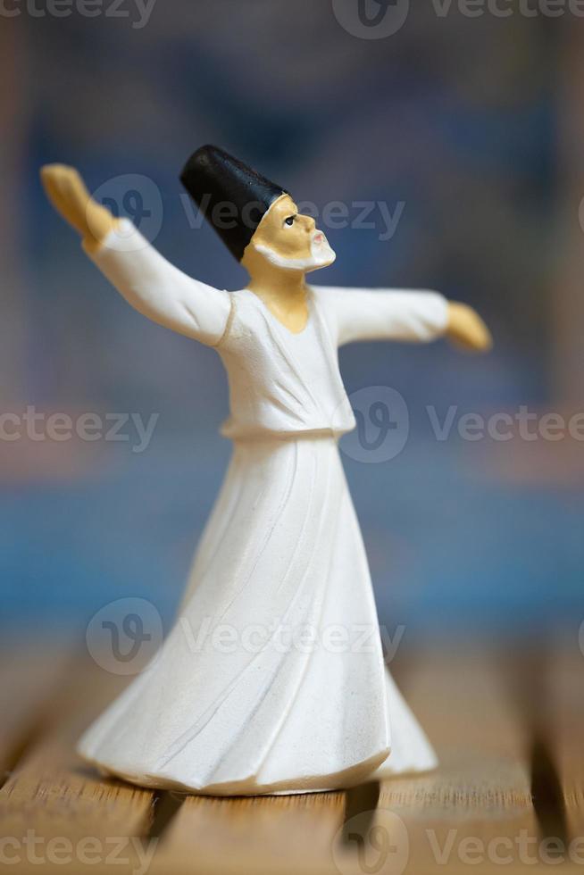 Macro photo of a small statue of a Sufi dancing the dance of Sama