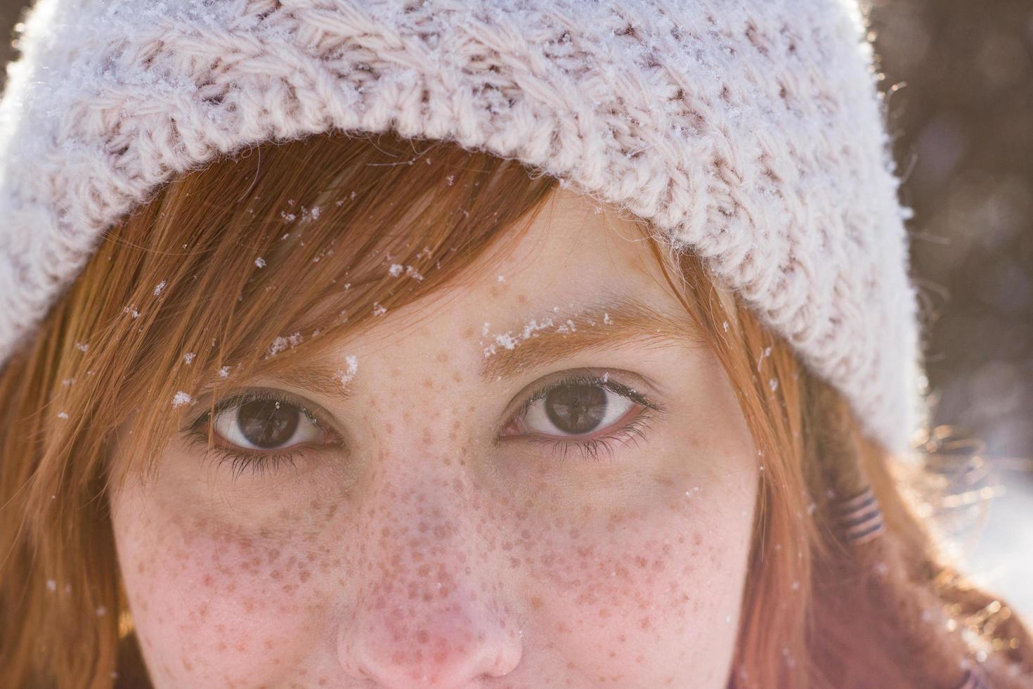 portraits of beautiful young woman in winter park photo