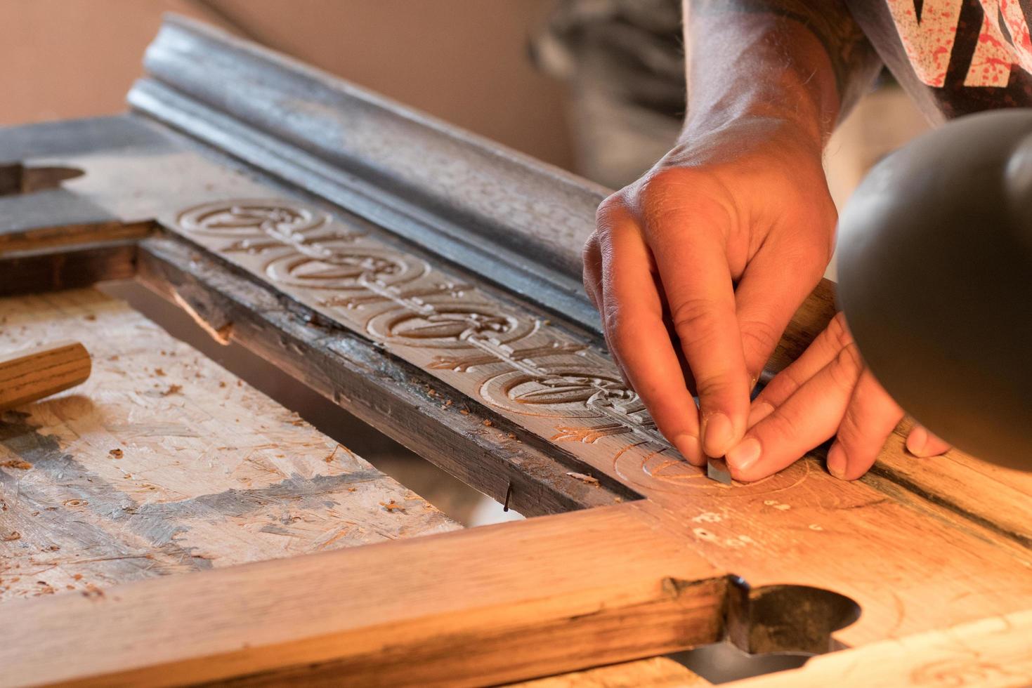 Woodcarving workshop, close up picture of tools and wood photo