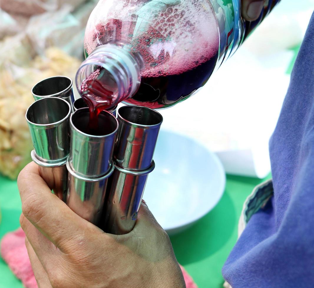 Making native ice crean in stainless tube. photo