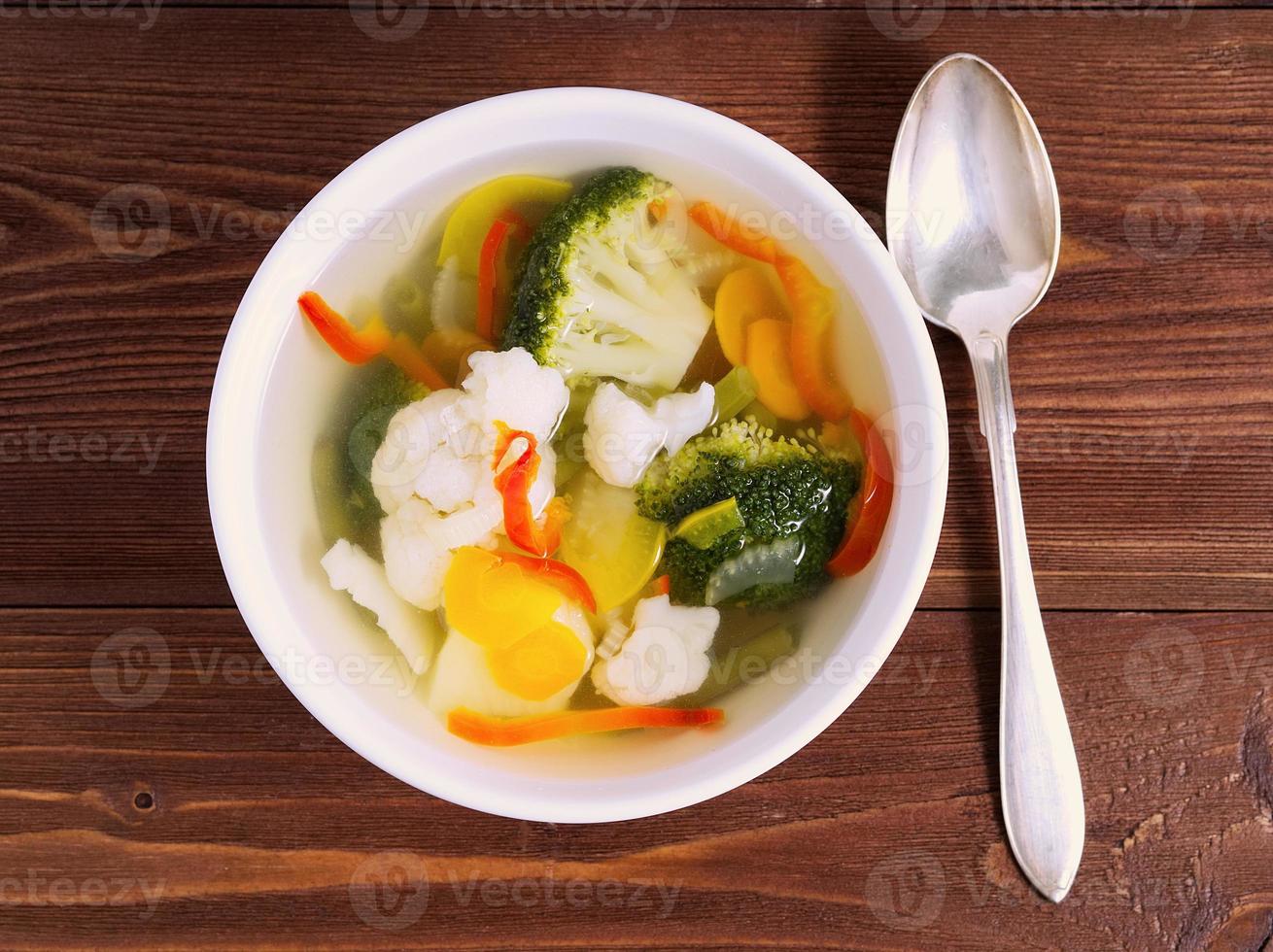 Bright dietary vegetarian soup with cauliflower, broccoli a photo