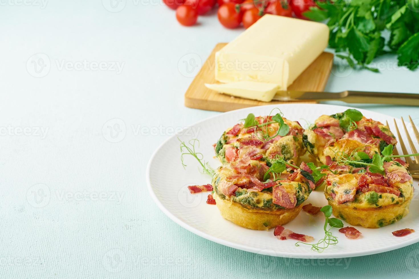 Egg muffin baked with bacon and tomato, ketogenic keto diet, pastel modern closeup copy space photo