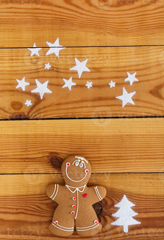 Christmas gingerbread cookies on wooden background photo