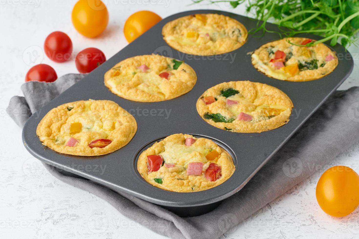 omelet with tomatoes and bacon, baked eggs with spinach and broccoli, closeup, keto, ketogenic diet photo