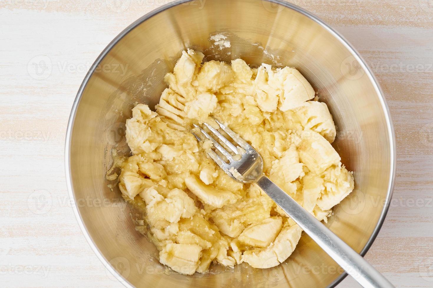 Mashed banana. Step by step recipe. Homemade Banana bread. Top view, wooden table. photo