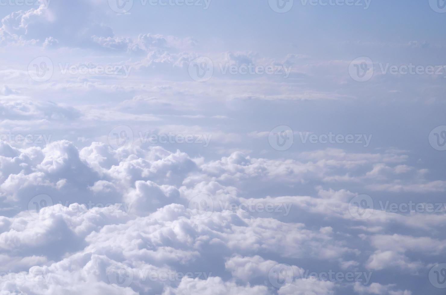 Beautiful cloudy sky from aerial view background. Airplane view above clouds. Sky and cloud texture. photo