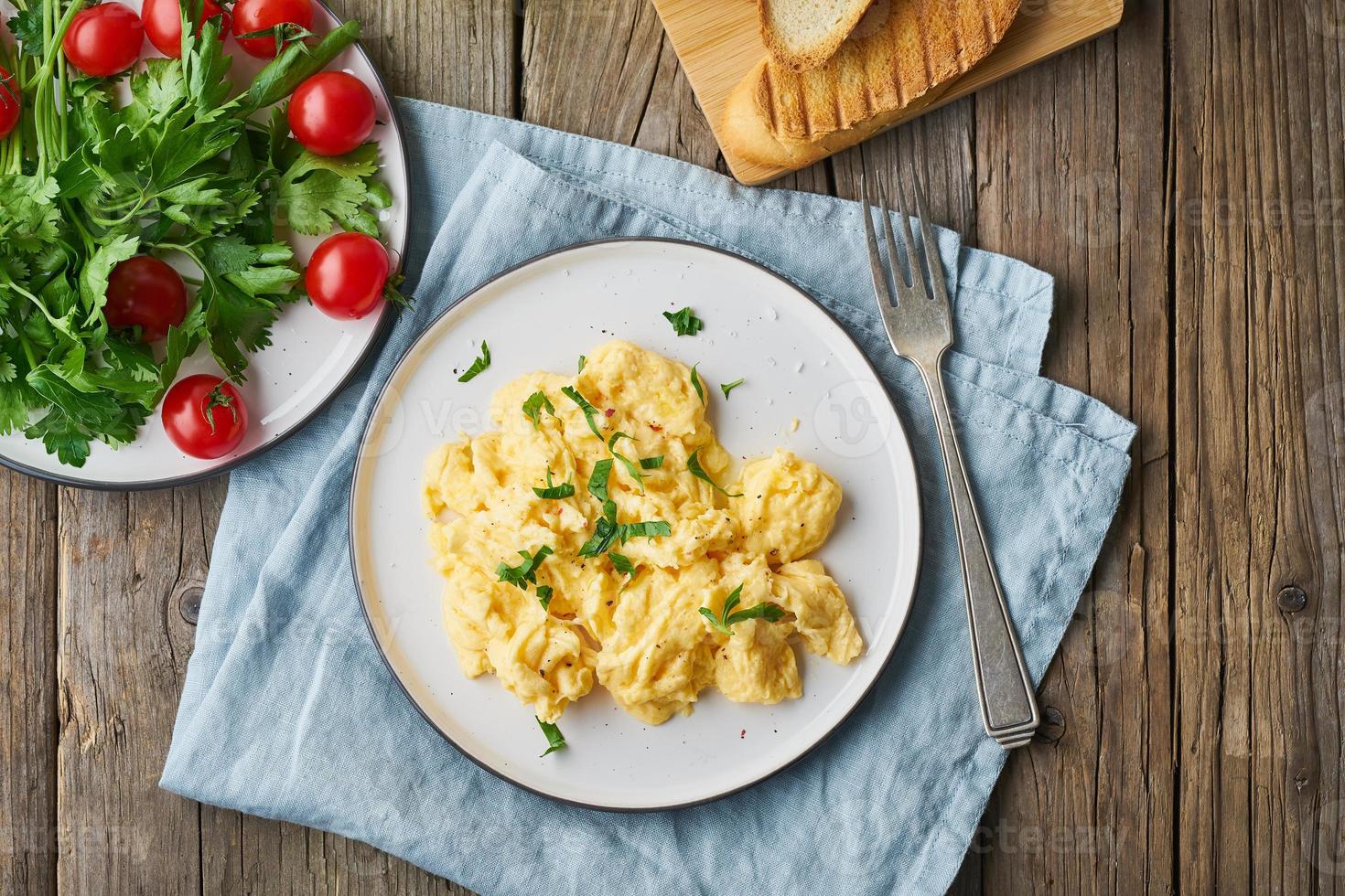 Scrambled eggs, omelette, top view, copy space. Breakfast with pan-fried eggs photo