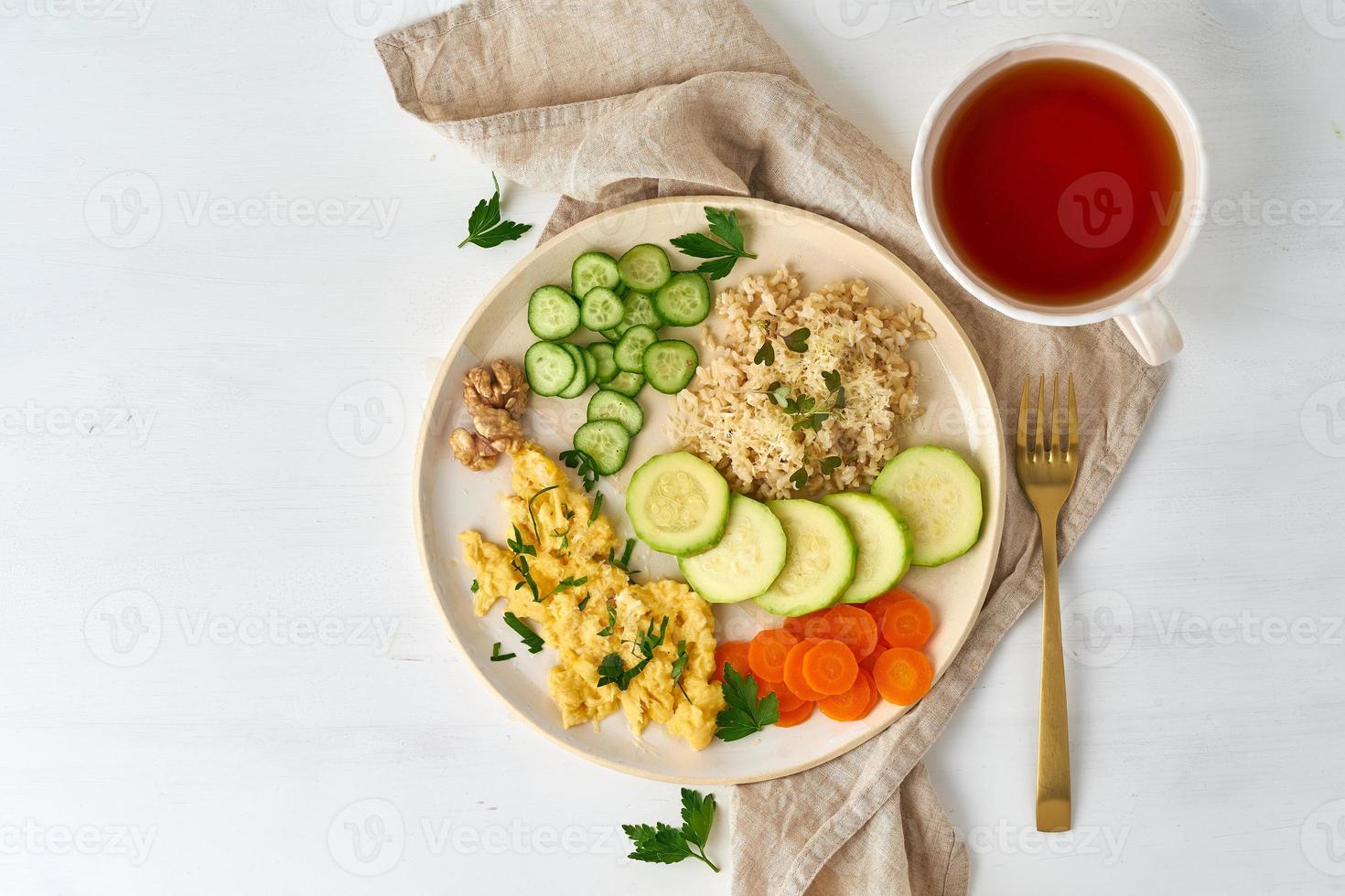 Balanced gluten free food, brown rice zucchini with scramble, dash fodmap diet photo