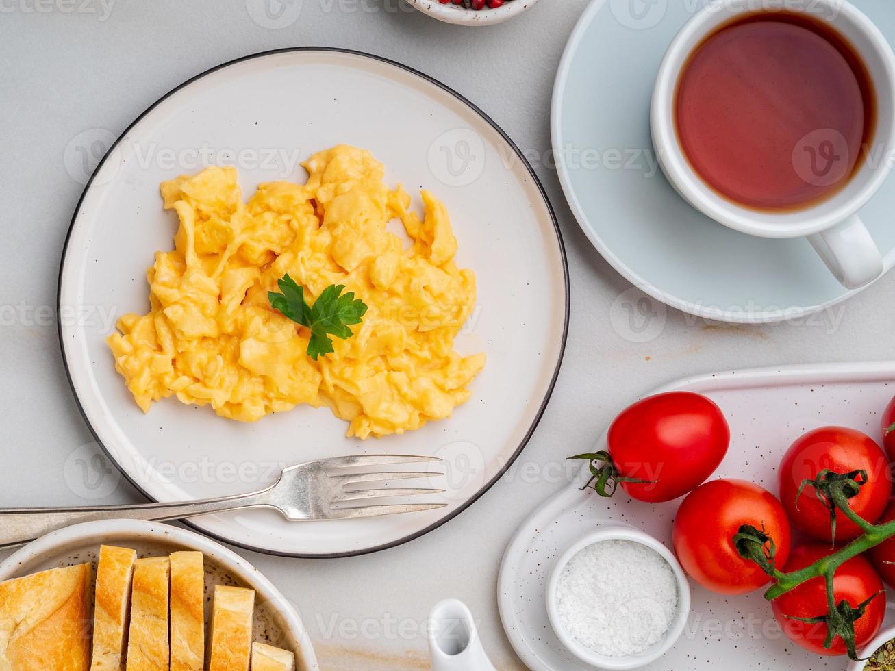 Scrambled eggs, Omelette. Breakfast with pan-fried eggs photo