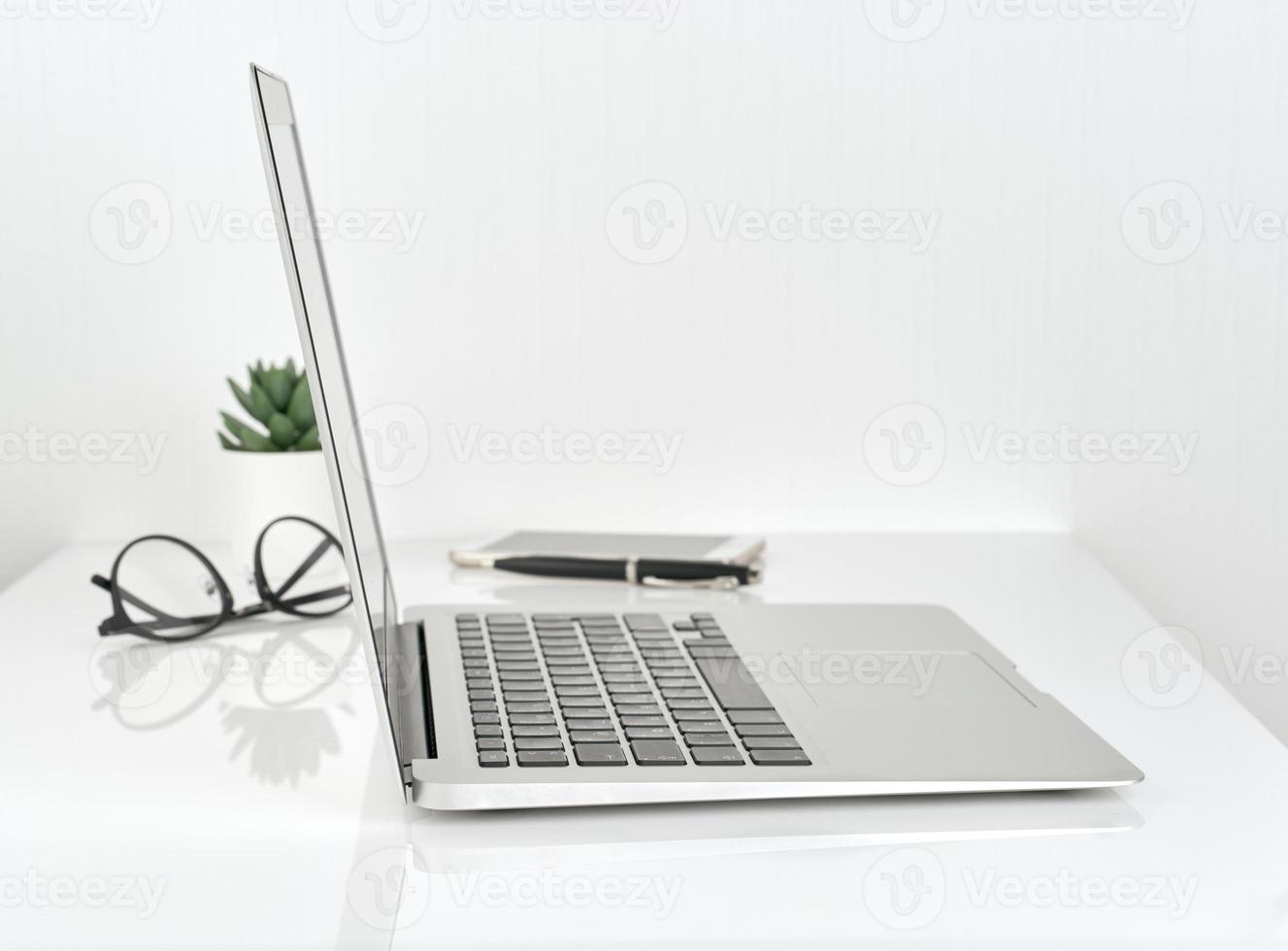 Working Space or Office desk, concept of study, white wall background photo