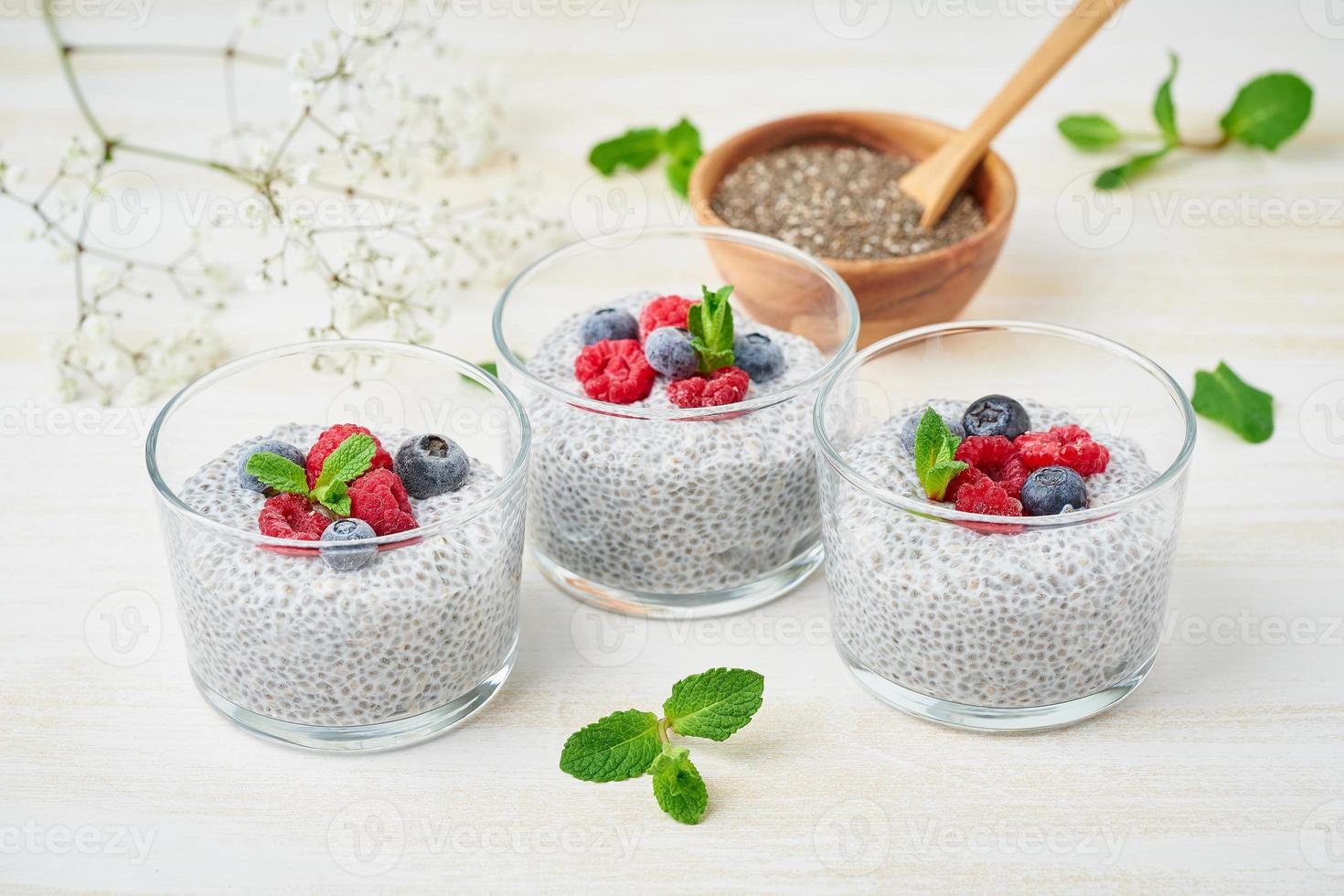 Banner with Chia pudding in bowl with fresh berries raspberries, blueberries. photo