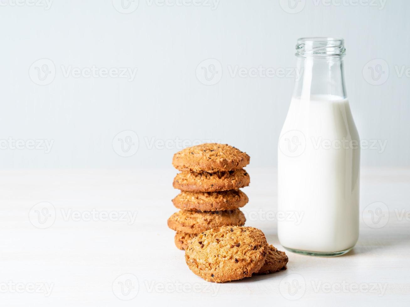 Chocolate oatmeal cookies and milk photo